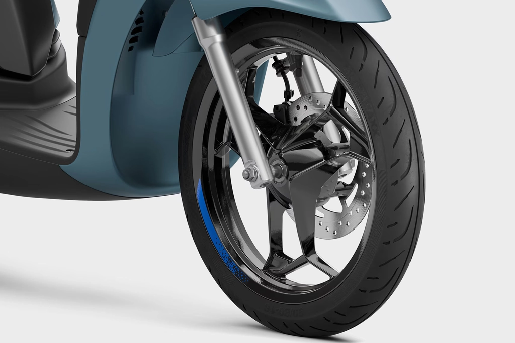 Piaggio Liberty en mouvement sur une avenue citadine